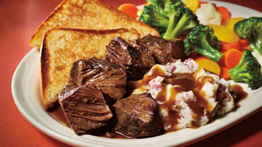 Oven Roasted Beef Brisket · Enjoy six ounces of extra tender brisket; served with steamed vegetables, gravy-topped garlic red skin mashed potatoes, and thick ciabatta toast.