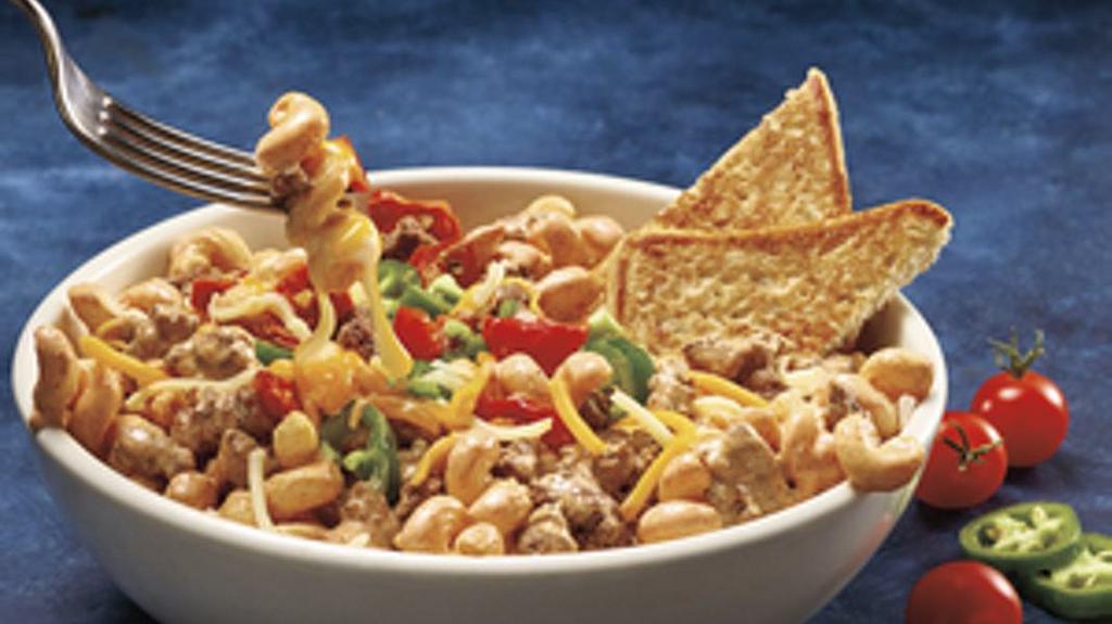 Tex-Mex Alfredo Taco Pasta · Spice is always nice. A Bolognese style Tex-Mex meat sauce and hearty pasta tossed in a creamy Alfredo Sriracha taco sauce. Served with toasted ciabatta bread.
