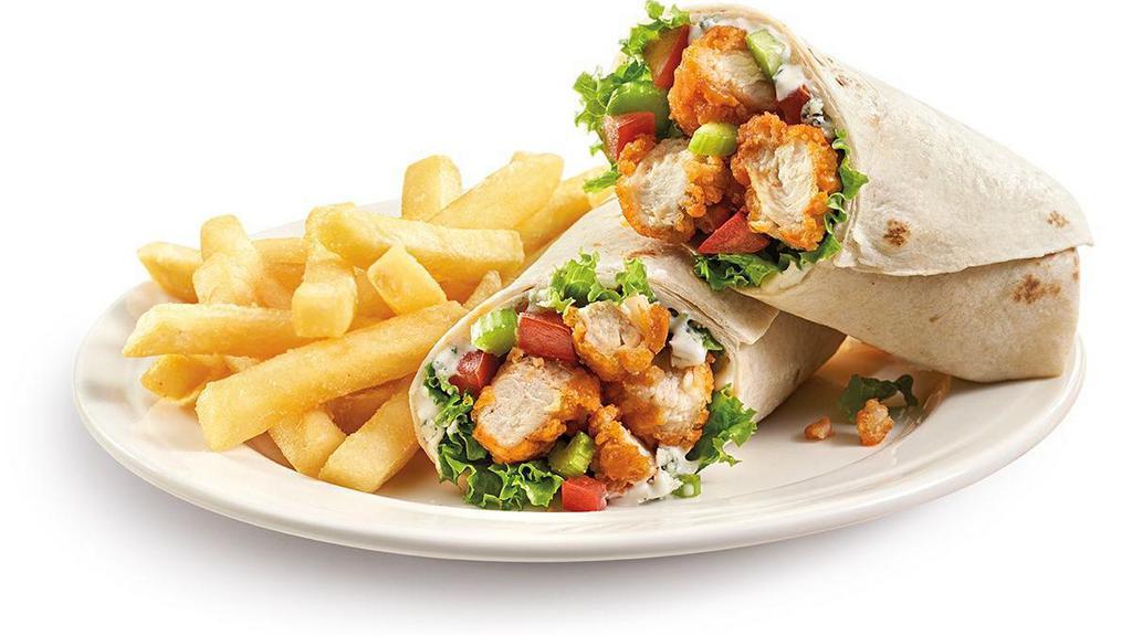 Buffalo Chicken Wrap · Crispy chicken tender pieces coated in Kickin’ Buffalo™ sauce and Bleu cheese dressing in a tomato wrap with fresh lettuce and tomato. Served with golden fries.