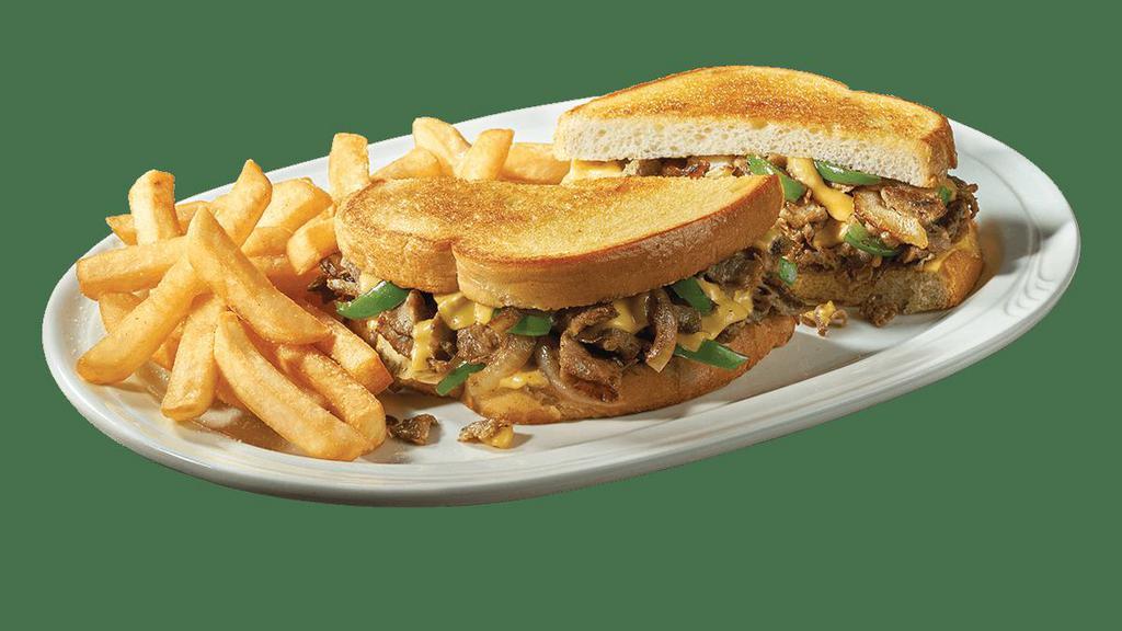 Philly Steak & Cheese Supermelt® · Savory grilled sirloin steak sliced thin and topped with sautéed green peppers and onions with melted American cheese on just-off-the-grill sourdough bread.   Served with a side of golden fries.