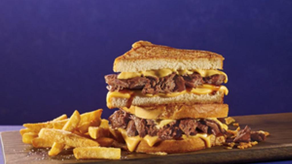 American Cheese Brisket Supermelt® · Melt-in-your-mouth beef brisket and melty American cheese are stacked on our parmesan-grilled sourdough to create this hearty iconic sandwich. Served with a side of golden fries.