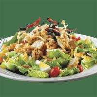 Crispy Chicken Salad · Crispy chicken tenders with Monterey Jack & Cheddar cheese, fresh tomatoes, sliced egg, colo...