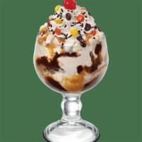 Reese'S® Pieces® Sundae · Vanilla ice cream, savory peanut butter topping, fluffy marshmallow, hot fudge, chocolate sp...