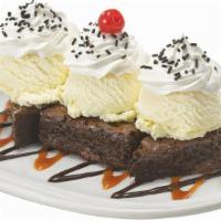New! Caramel Fudge Brownie Sundae · 3 scoops of Vanilla ice cream served over two brownies with hot fudge, caramel, whipped topp...