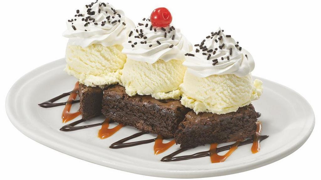 New! Caramel Fudge Brownie Sundae · 3 scoops of Vanilla ice cream served over two brownies with hot fudge, caramel, whipped topping, chocolate sprinkles and a cherry on top.