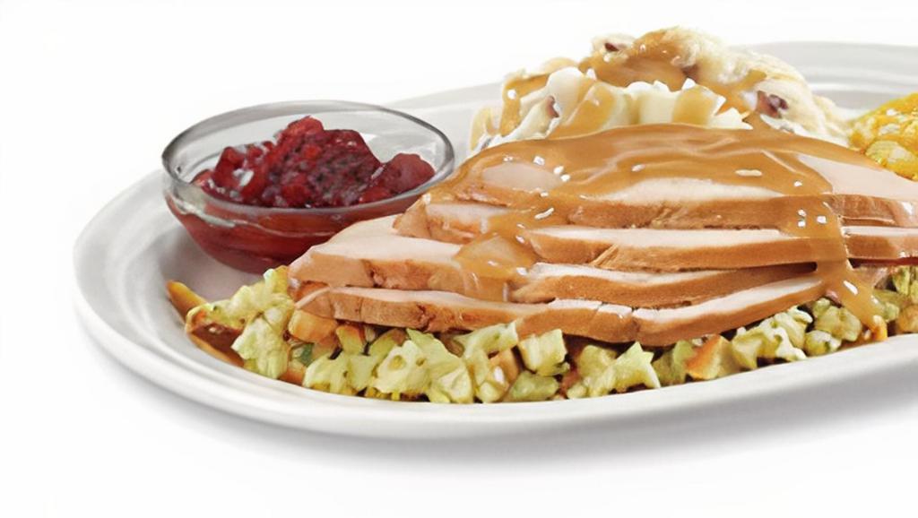 Turkey Dinner - Serves 4-5 · Sliced Turkey Breast with  flavorful stuffing and turkey gravy and cranberry sauce.  Served with your choice of two sides:  red skin mashed potatoes, corn, rice or broccoli.