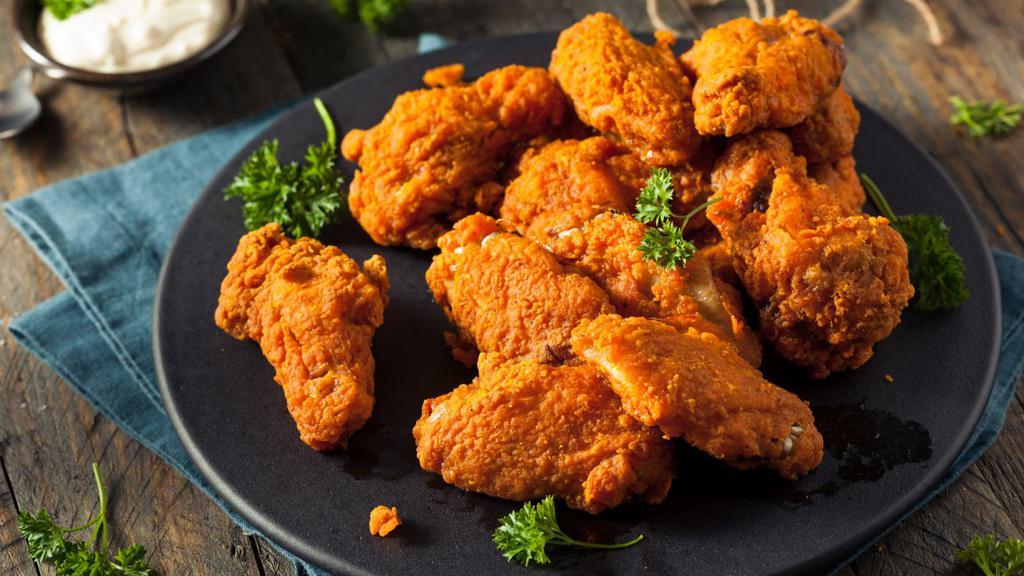 Buffalo Wings · Golden, crispy, deep-fried wings, smothered in spicy Buffalo sauce. Add on a dipping sauce and side!