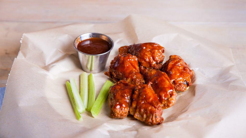 Bbq Wings · Golden, crispy, deep-fried wings, glazed with smoky and sweet BBQ sauce. Add on a dipping sauce and side!