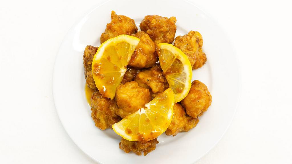 Lemon Pepper Wings · Golden, crispy, deep-fried wings, glazed with tangy and peppery sauce. Add on a dipping sauce and side!
