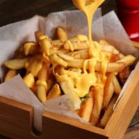 Hot Cheese Fries · Golden, crispy, fries smothered with hot nacho cheese.