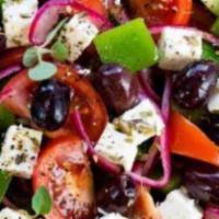 Greek Salad · Lettuce, cucumber, tomatoes, red onion, corn, kalamata olives and feta cheese with olive oil...