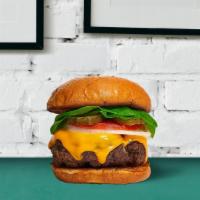 Cheeseburger · Juicy beef patty tossed on melted cheese and burger buns with lettuce, tomatoes, and onions.