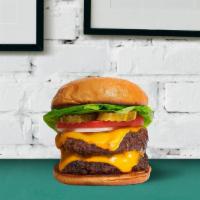 Double Cheeseburger · Two sizzling beef patties with american cheese, lettuce, tomatoes and onions.