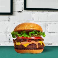 Classic Beef Burger · Juicy beef patty tossed on burger buns with lettuce, tomatoes, and onions.
