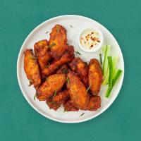 Chicken Wings · Fresh chicken wings breaded and fried until golden brown. Served with a side of ranch or ble...