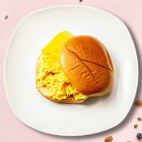 Egg And Cheese Sandwich · Scrambled egg, cheddar cheese, sliced tomato, and caramelized onions served.