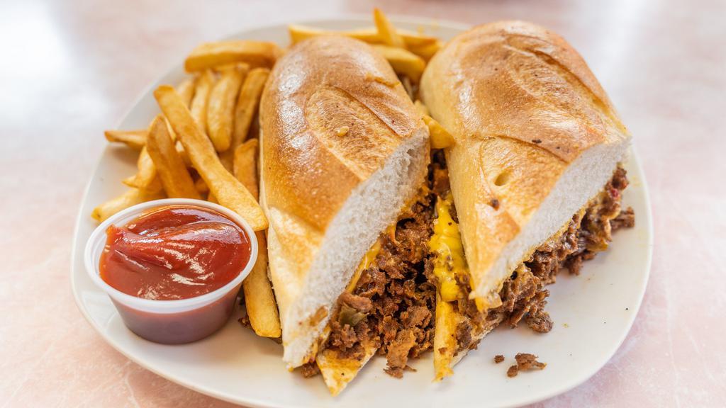 Philly Cheese Steak On Hero With Fries · Steak, cheese, and caramelized onion sandwich.