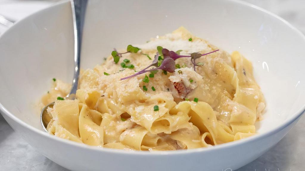 Fettuccine Tuscano · Fettuccine Pasta with Shrimp, White Beans, Shiitake Mushrooms & Garlic in a Creamy Pesto Sauce.