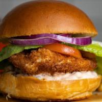 Classic Fried Chicken · Dish out on crispy fried chicken with caper aioli, lettuce, and tomato. Add some fries to co...