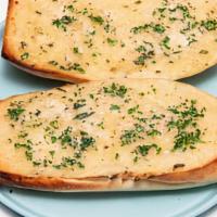 Garlic Bread · Toasted with vegan butter and in house spices.