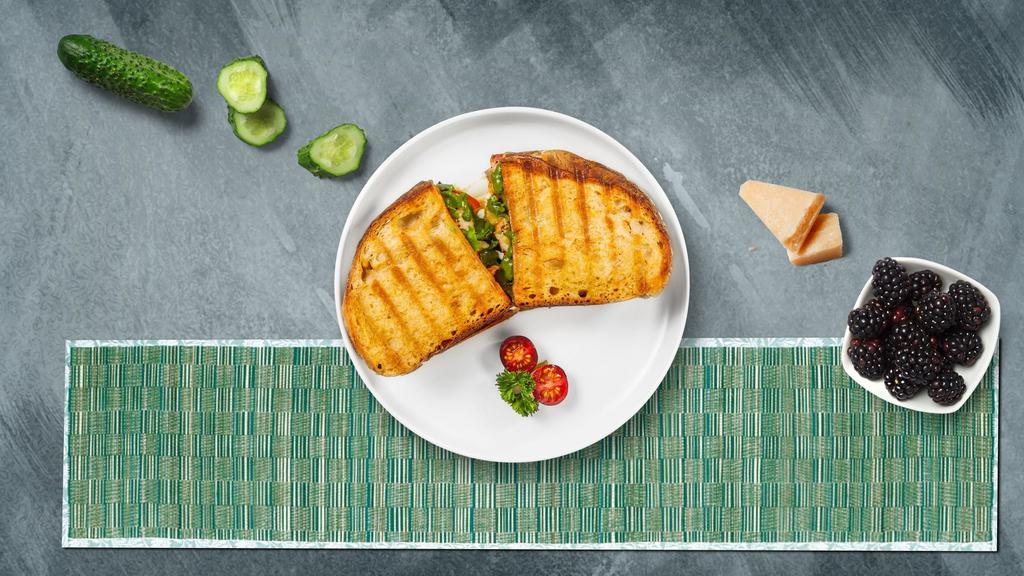 Chronicles Of Chicken Pesto Panini · Chicken, melted cheese, pesto, lettuce and tomato served on your choice of toasted bread.