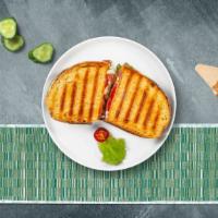 Grizzly Grilled Ham Panini · Ham, melted cheese, lettuce and tomato served on your choice of toasted bread.