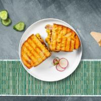 Papi Cuban Panini · Roasted pork, pork tenderloin, melted cheese, mustard, and pickles served on your choice of ...