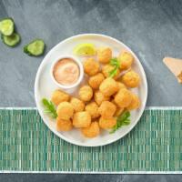 Tots To Ponder · Shredded Idaho potatoes formed into tots, battered, and fried until golden brown. Served wit...