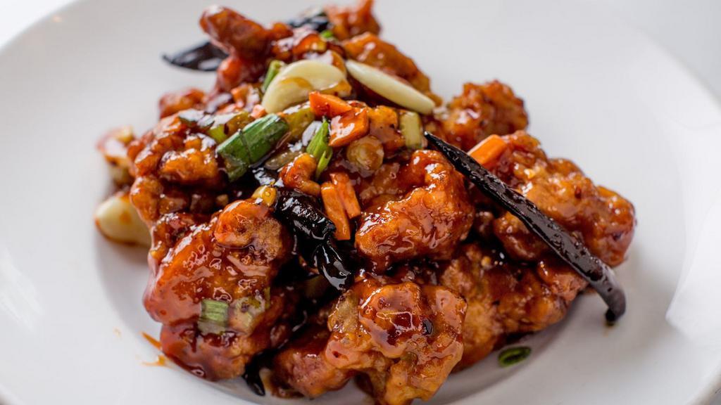 Chan Do Chicken With Scallions · Hot and spicy. Crispy chicken nuggets marinated with five spices, then sautéed with ginger, garlic, scallions, and hot peppers.