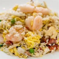 Young Chow Fried Rice · Combination with Roast Pork, Chicken & Shrimp.