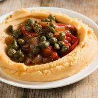 Fava · Creamy golden split pea purée. Topped with tomato, onion sauce, and capers.