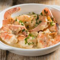 Sautéed Shrimp · Served with shell, sautéed with olive oil and garlic, and finished with our ouzo anise cream...
