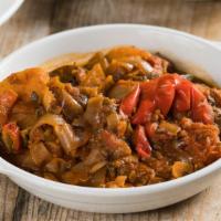 Briam · A roasted veggie dish with hearty chunks of zucchini and potato, colorful bell peppers, onio...