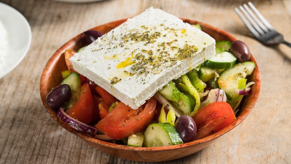 Horiatiki Salad · Traditional no-lettuce-having-Greek salad with chunky tomatoes, onions, cucumber, bell peppers, Kalamata olives, and feta. The staple of any good Greek spread.