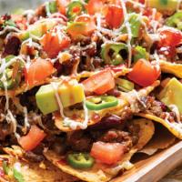 Tequila Nachos · Come with rice, black beans, mixed cheese, lettuce, tomatoes, cream, cheese, and guacamole.
