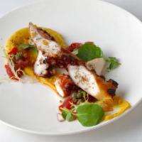 Grilled Octopus · over Santorini fava with roasted red peppers, caramelized onions and capers