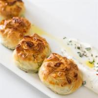 Spinach Pies · 3 individuallly wrapped spinach parcels served with ouzo yogurt