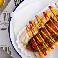 All American · Classic beef hot dog topped with ketchup, mustard, relish and onions.