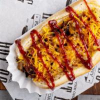 Hawaiian Dog · Grilled beef hot dog topped with bacon, cheese, BBQ sauce, grilled onions and grilled pineap...