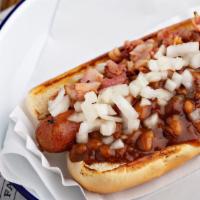 Boston Dog · Steamed beef hot dog topped with factory baked beans, bacon bits and chopped onions.