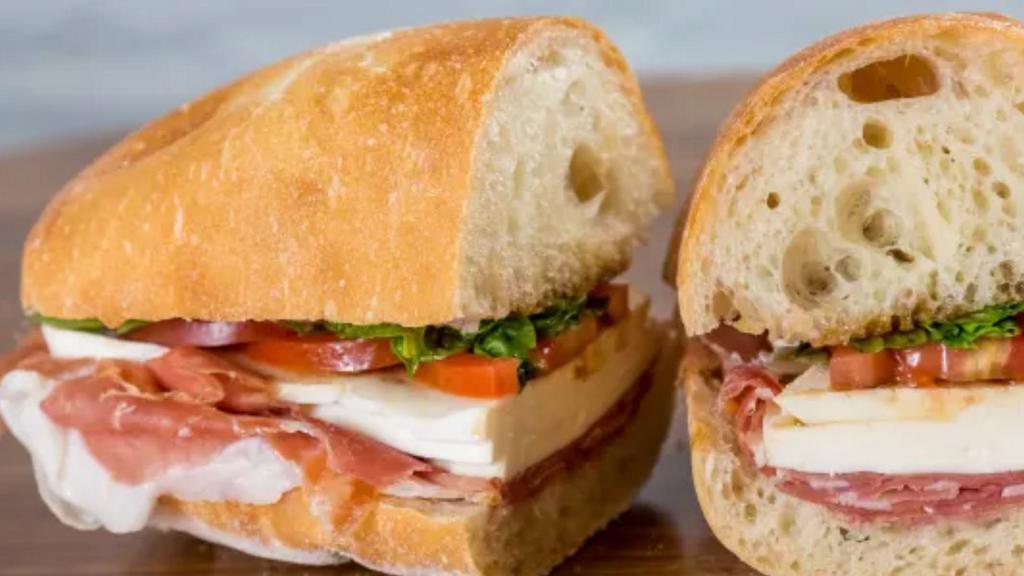 Prosciutto Di Parma · With fresh mozzarella, sliced plum tomatoes, fresh basil, extra virgin olive oil, and balsamic.