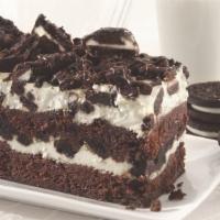 Oreo Mud · Double layers of decadent brownie layered with white chocolate cheesecake and white chocolat...