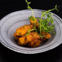 V{Iv} Wing · Fried marinated chicken wings tossed in caramel garlic sauce, an awesome new take on a favor...