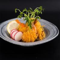 Blanketed Shrimp · Fried shrimp wrapped in egg noodle served with Thai sweet chili dipping.