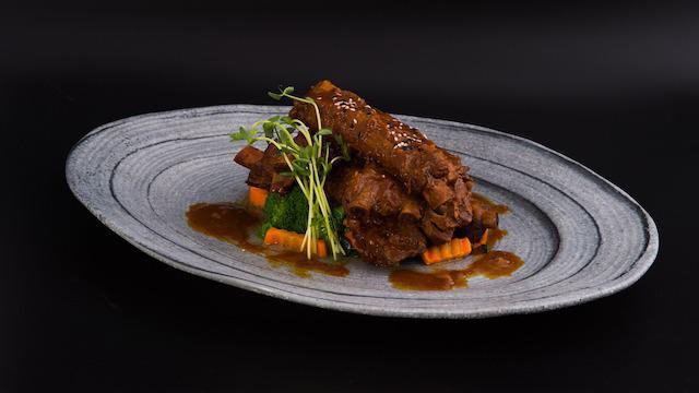 Bbq Spare Ribs · We “spare” no ribs! these premium pork ribs are marinated in v{iv}’s own blend of herbs & spices served with steamed vegetable.