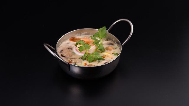 Tom Kha Soup · Yes, tom kha is super famous! select from chicken, shrimp, vegetables, or tofu. Both love to party in creamy coconut milk & galangal broth, topped with mushroom, scallion & cilantro.