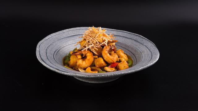Cashew King · Spicy. Sauteed with roasted cashew nuts, onions, scallions, pineapple, bell peppers & carrots.