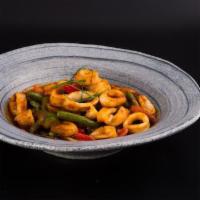 Pad Prik King · Spicy. Sauteed with chili paste, string beans, bell peppers & a hint of kaffir lime leaves.