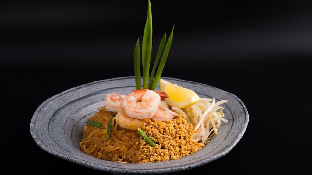 Pad Thai · Traditional Thai dish of stir-fried thin rice noodles with egg, bean sprouts, scallions & crushed peanuts. . Go on. You know you love it!