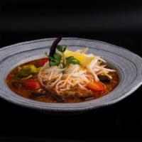 Kanom Jean Nam Ngeow · Popular northern noodle soup. Rice vermicelli, minced pork, congealed pig blood in spicy por...